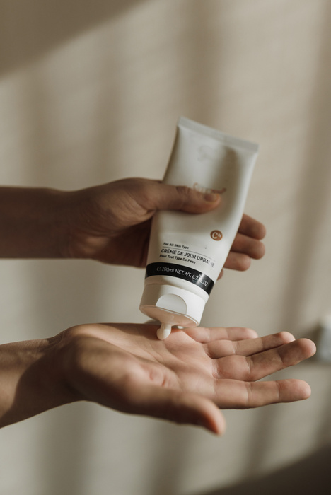 A Close-Up Shot of a Person Using a Skincare Product